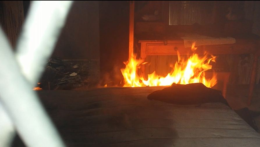 Paramedics attend to victim of house fire in Oslo Beach near Port Shepstone