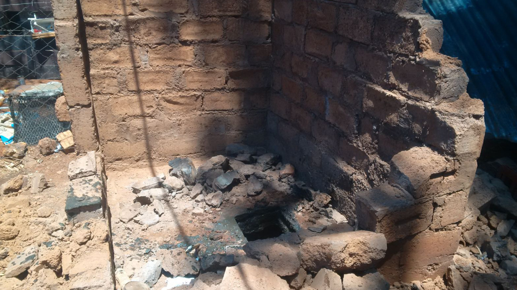 Woman rescued from pit toilet