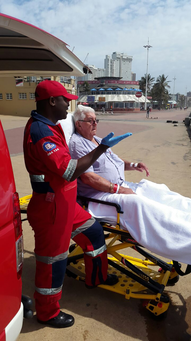 Lucas Nzimande, from ER24 Durban, with Mr Dirk Gunther (84), at the beach.