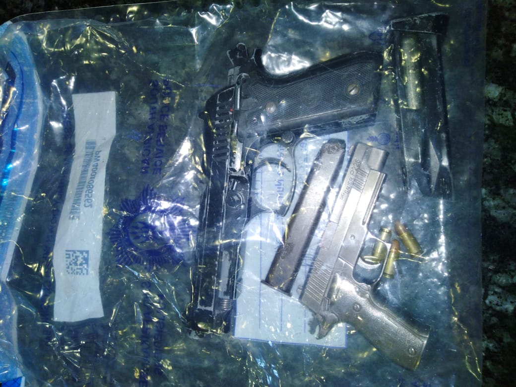 Police arrested two suspects for possession of a hijacked vehicle and replica firearms