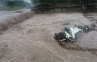 Taxi swept off bridge into the Duzi river