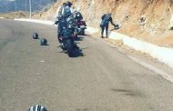 What does a motorcycle helmet placed on the road surface/ ground mean?