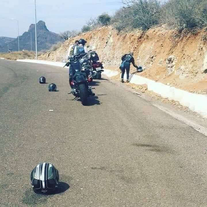 What does a motorcycle helmet placed on the road surface/ ground mean?