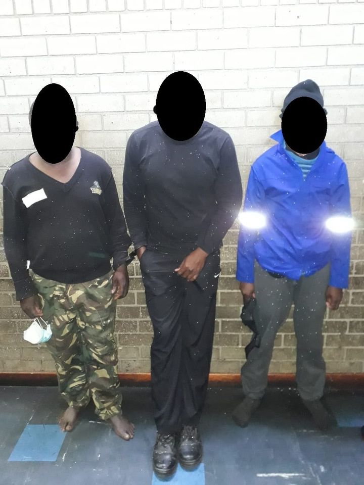 Security guards behind bars for business robbery.