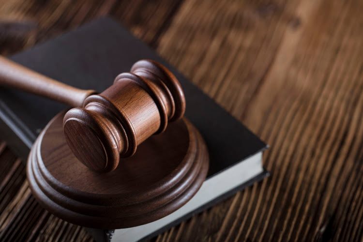 Axe murder accused slapped with six life sentences in prison