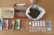 Two behind bars as police confiscate drugs and counterfeit money