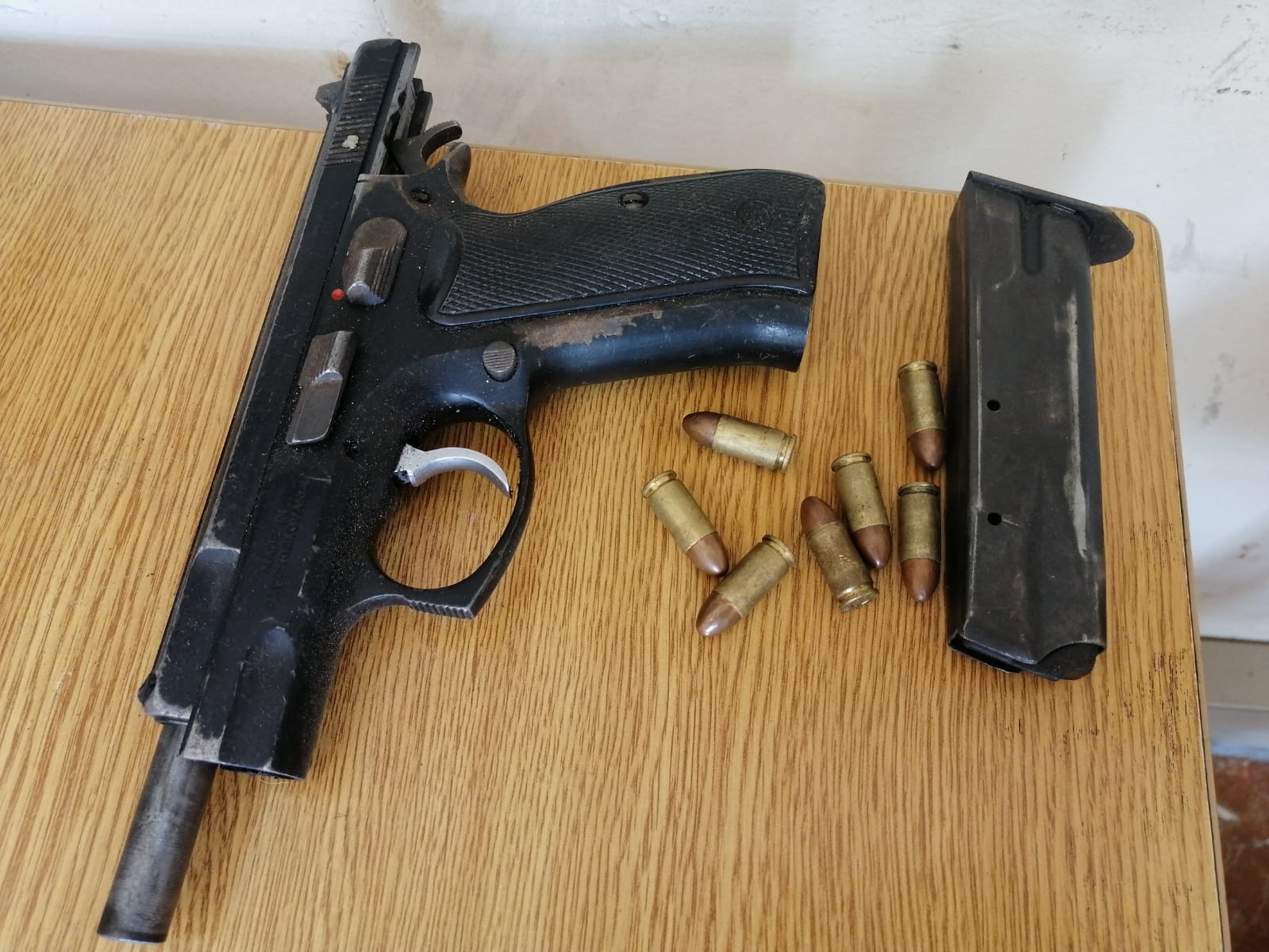 Two suspects arrested on murder and possession of unlicensed firearm charges