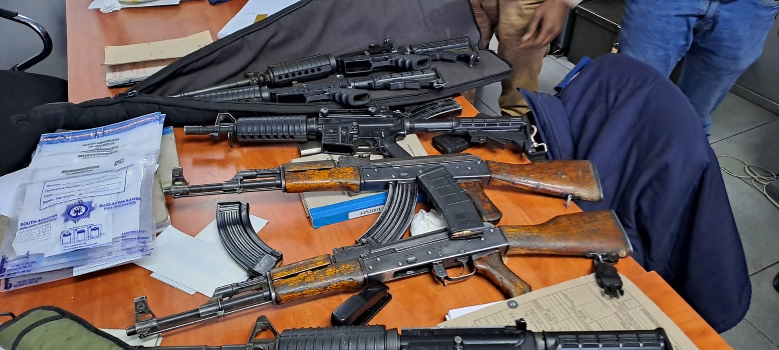 Two security guards arrested with six rifles and 136 live ammunition