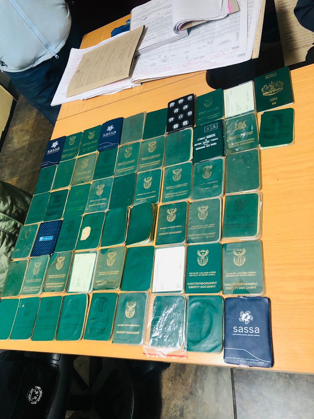 Police arrest a male in possession of more than 90 IDs and bank cards
