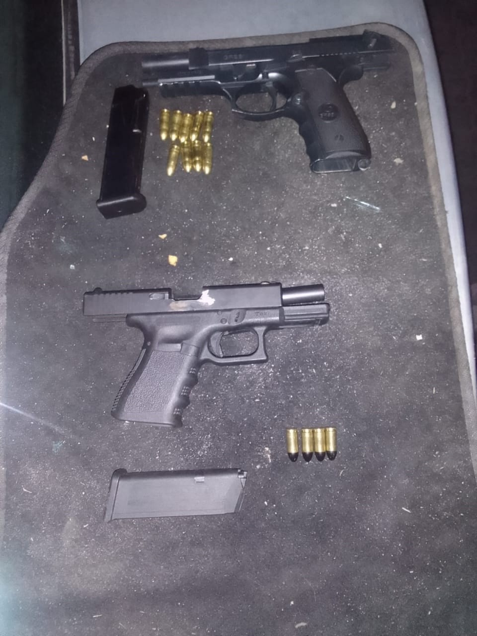Three suspects on their way to court on charges of kidnapping and possession of prohibited firearms and ammunition