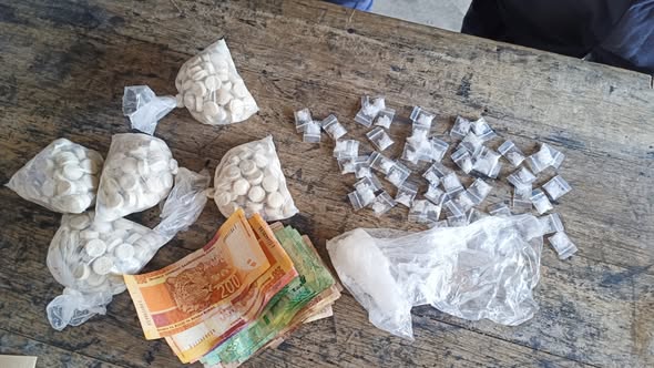 Police arrest suspects for possession of drugs and dealing in liquor without a license